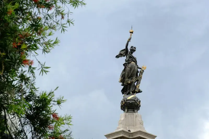 Statue atop a church in Ecuador
