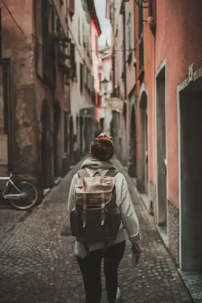 backpacker walking through city streets